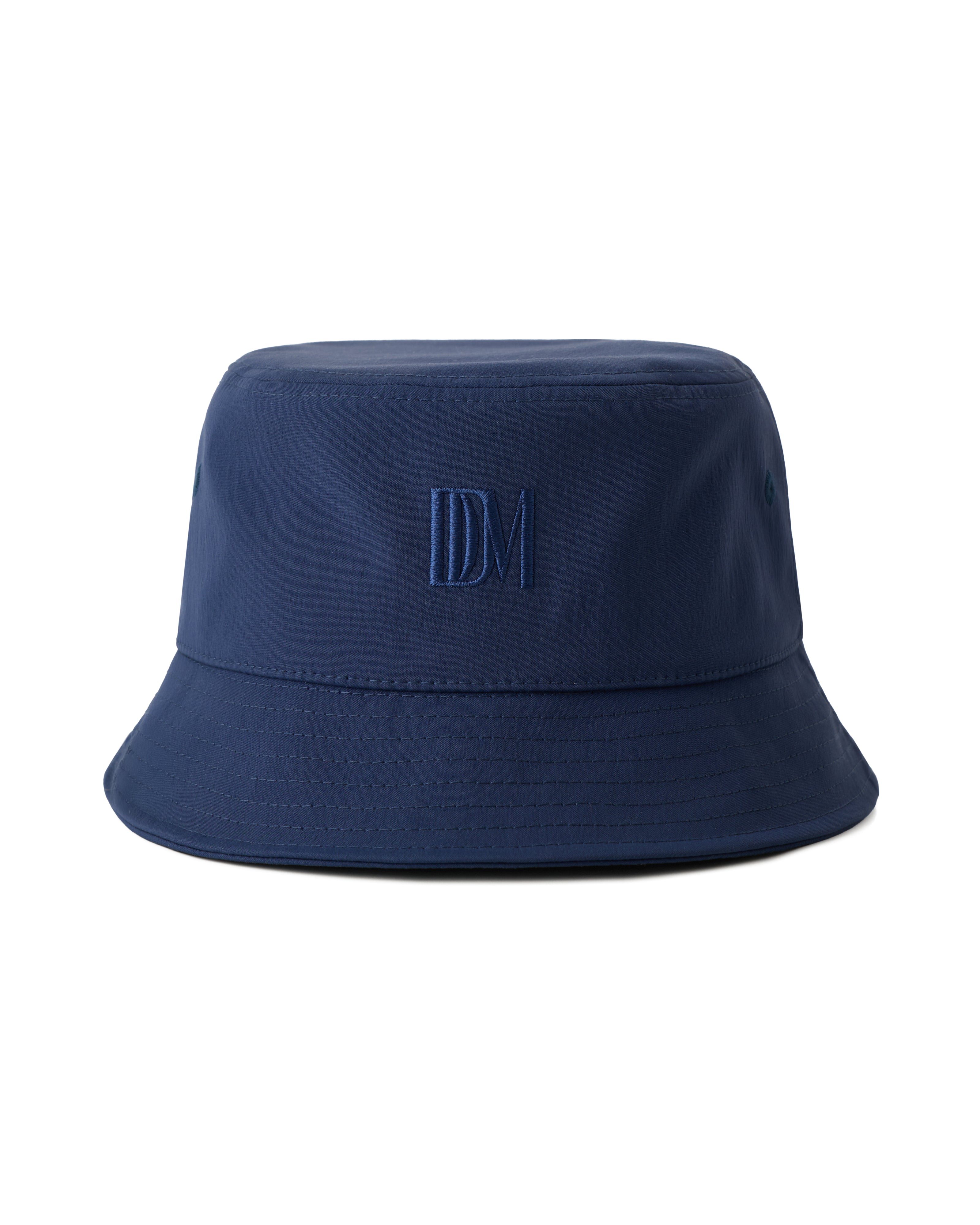 The Bucket Hat - Anchor by Dandy Del Mar in navy blue, featuring "DM" embroidered on the front, displayed against a plain white background.