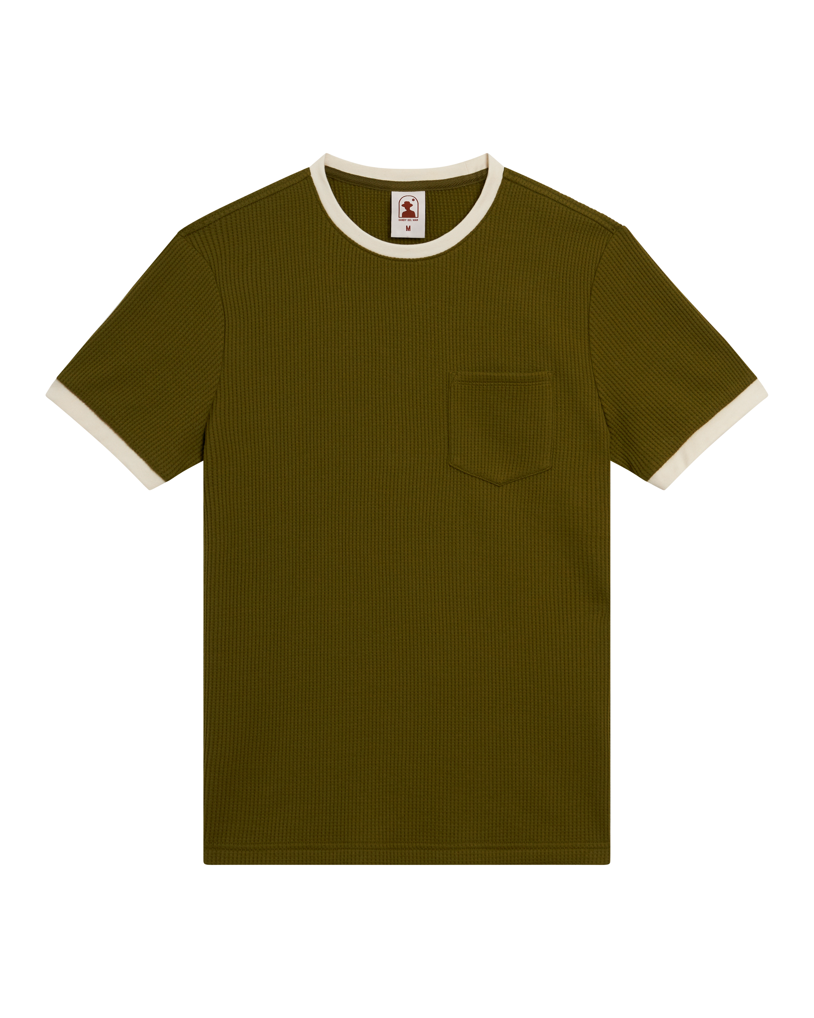 The Cannes Waffle Knit Tee - Arbequina by Dandy Del Mar, a short-sleeve olive green waffle knit t-shirt with chest pocket and white-trimmed contrast collar and sleeves, is shown laid flat on a black background.
