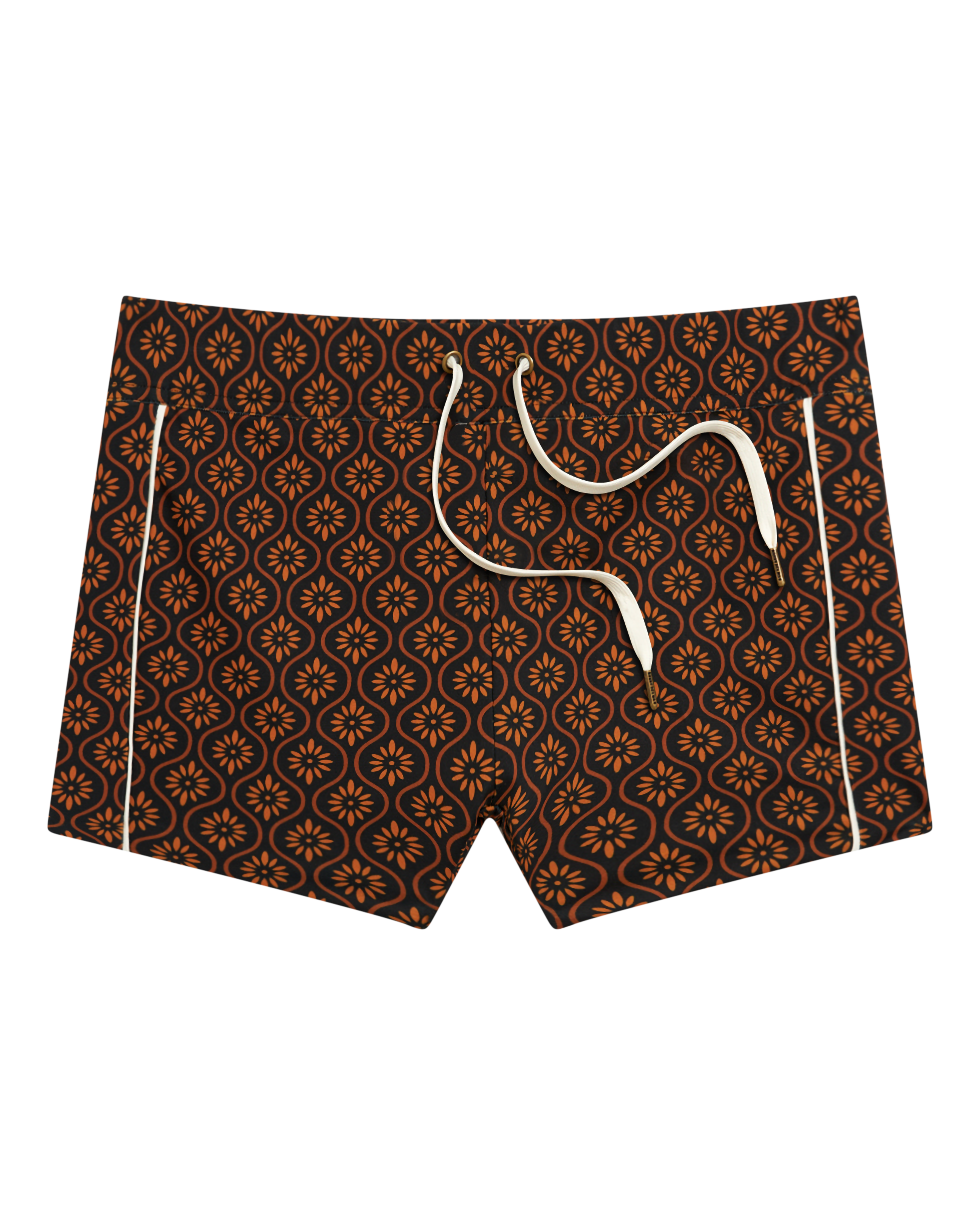 The Cassis Square Cut Swim Brief - Cacao by Dandy Del Mar: men's swim trunks crafted from recycled polyester with a brown, orange, and black geometric floral design and white drawstrings, shown against a black background.