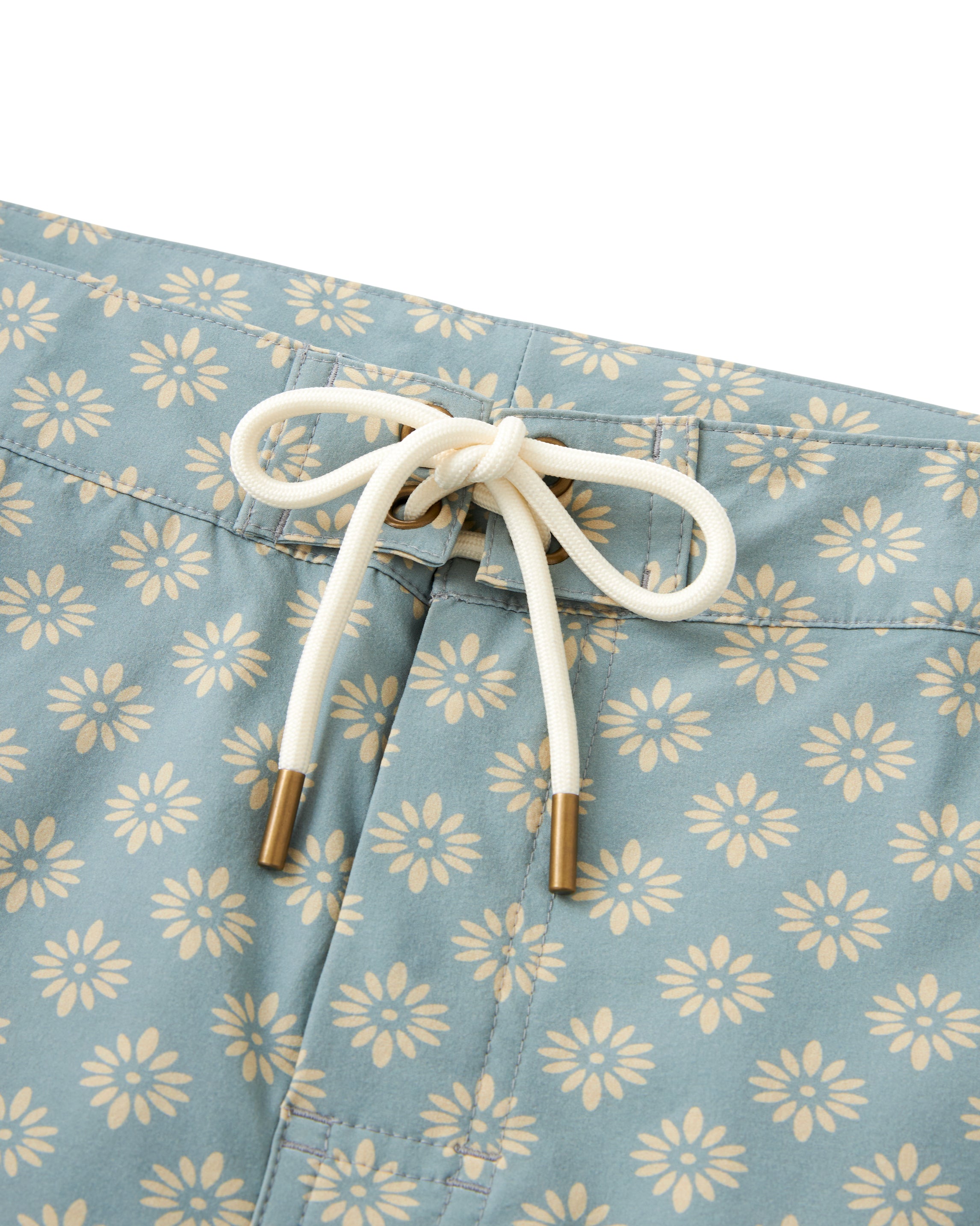 The Dandy Del Mar Stirata Swim Short - Abalone, made with water resistant fabric, features a blue and gold floral design.