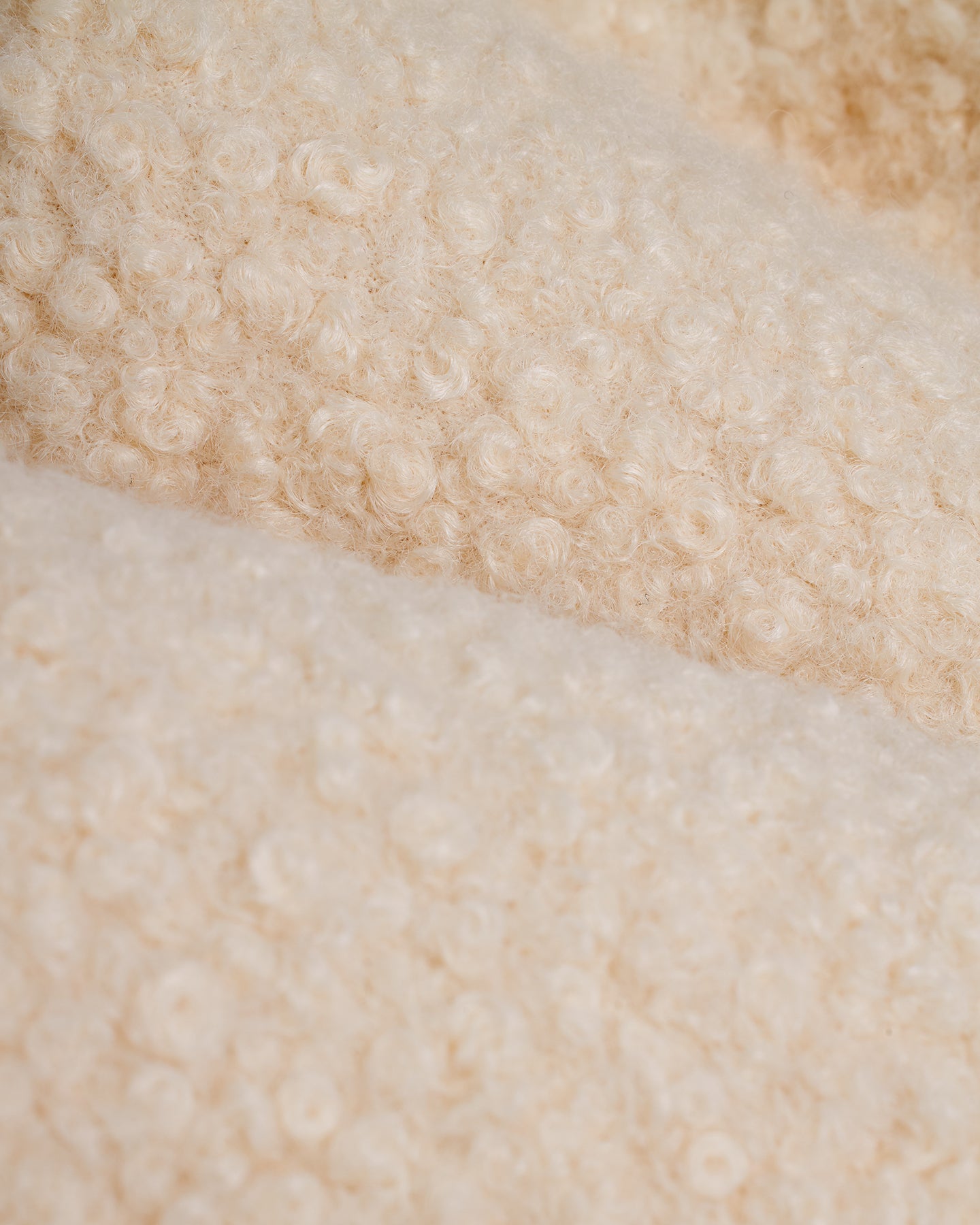 A close up of a Dandy Del Mar Cusco Sherpa Pullover - Vintage Ivory.