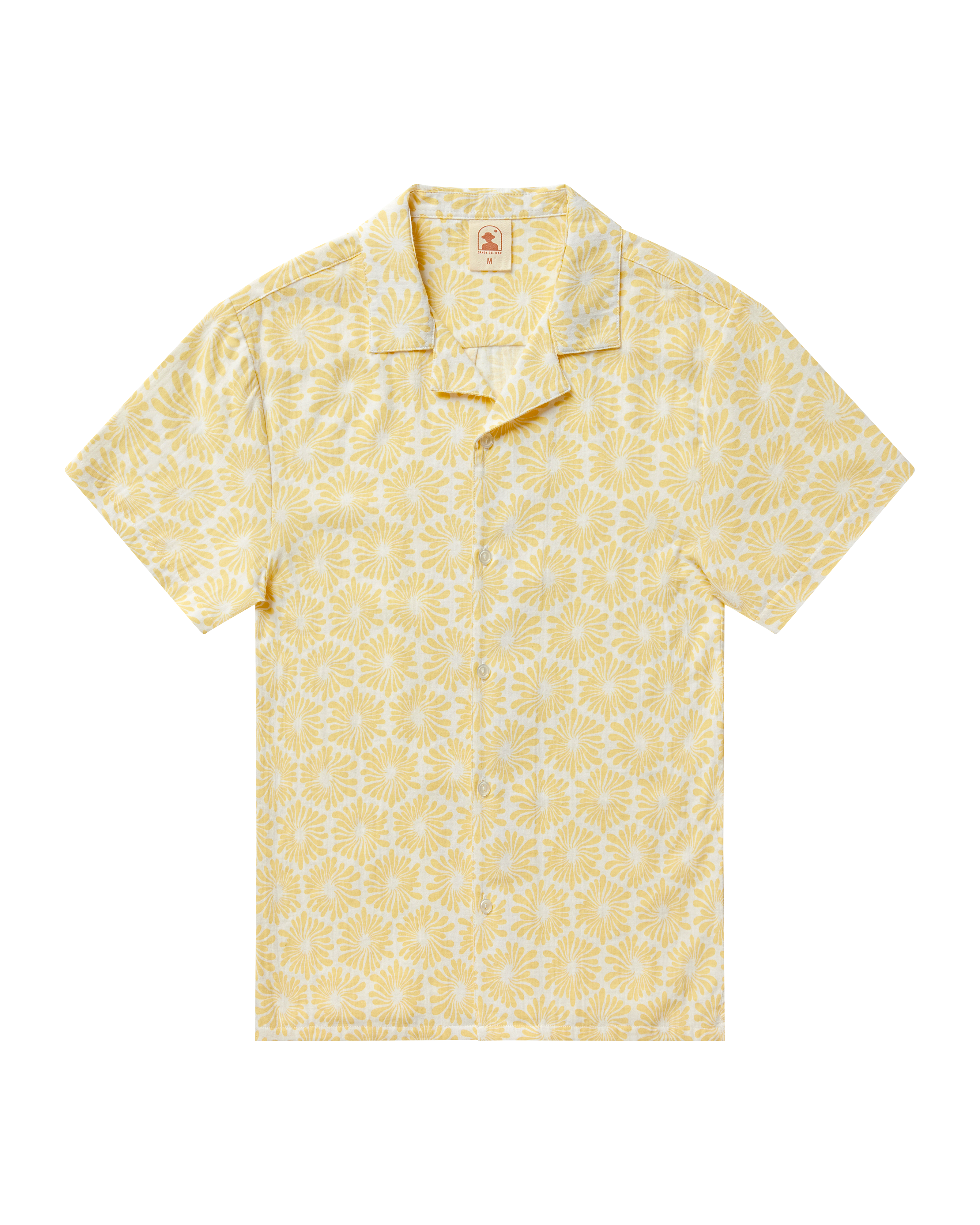 The Grenadine Crinkle Gauze Shirt - Cream Fleur Print by Dandy Del Mar is a short-sleeved, button-up shirt in a yellow and white floral pattern, crafted from lightweight crinkle gauze—perfect as a stylish travel essential.
