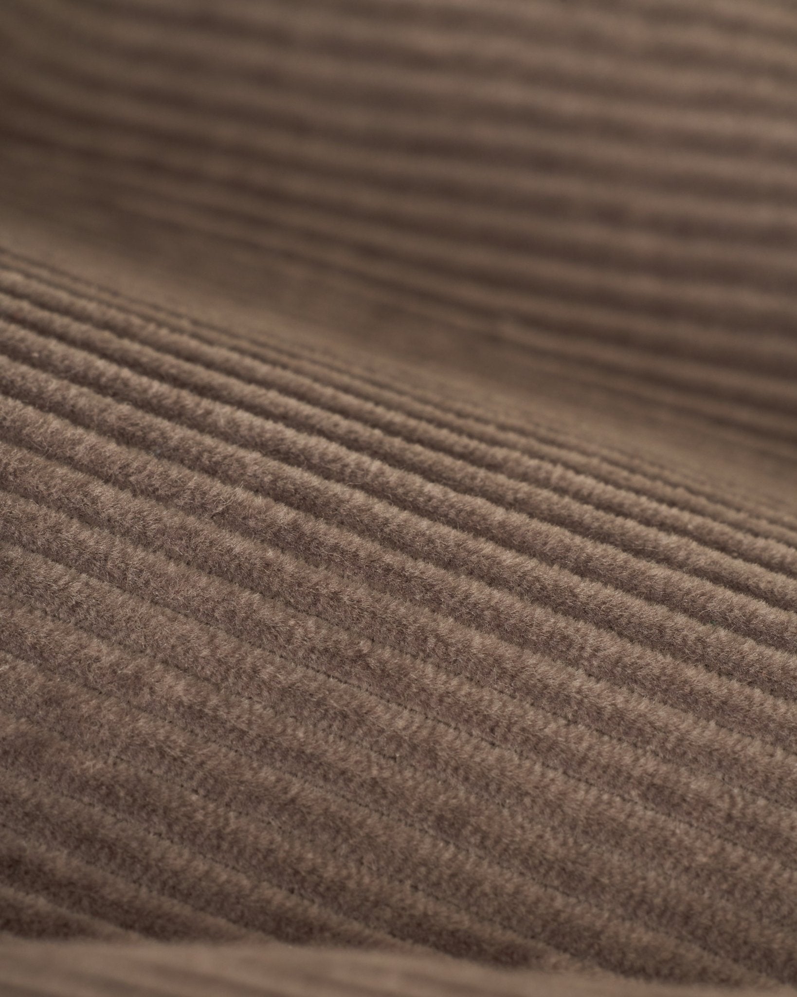 Close-up of The Corsica Corduroy Shorts in Argento by Dandy Del Mar, showcasing the brown corduroy fabric’s texture and parallel ridges.