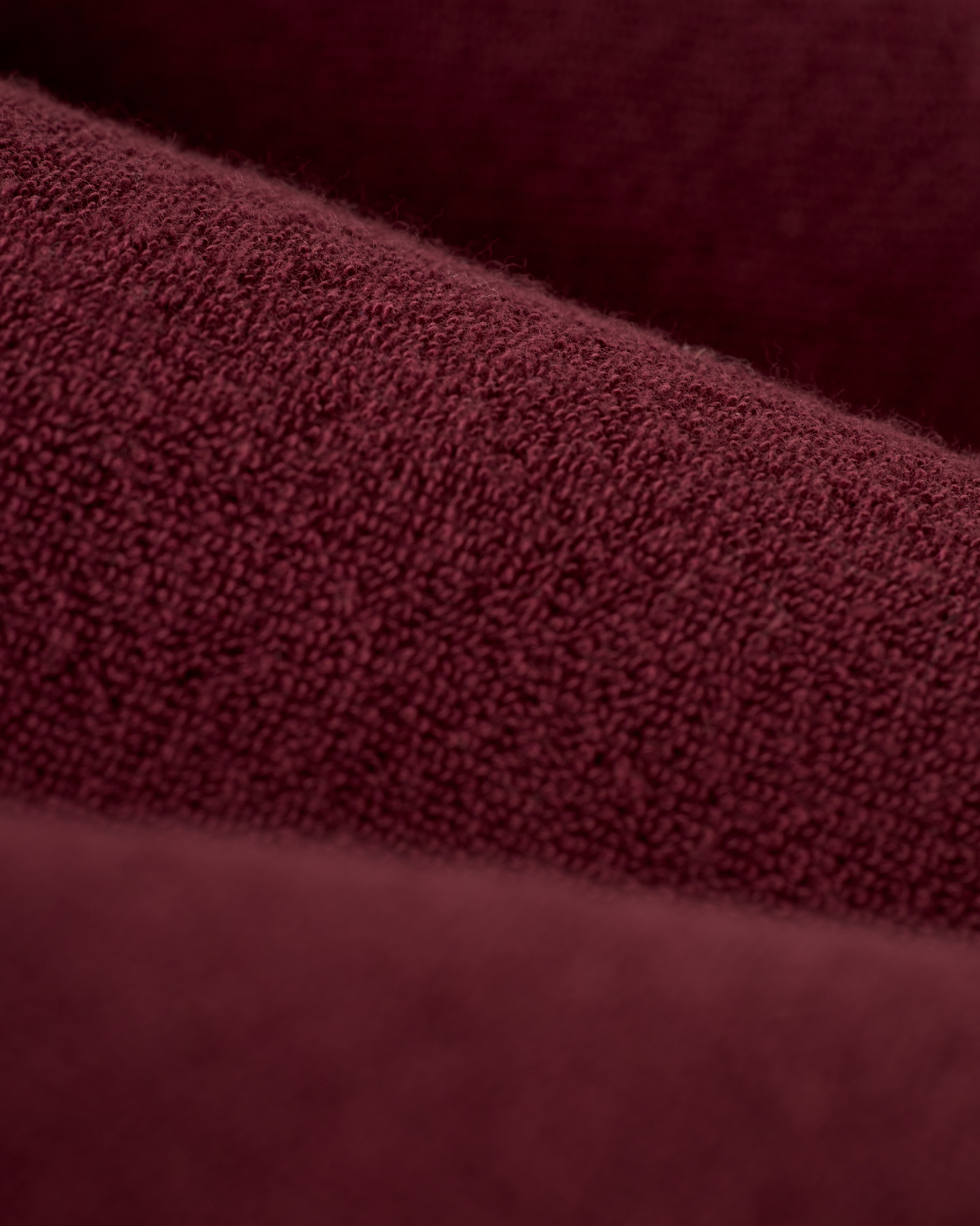 Close-up view of The Gaucho Short in Bordeaux by Dandy Del Mar, featuring a textured, looped surface.