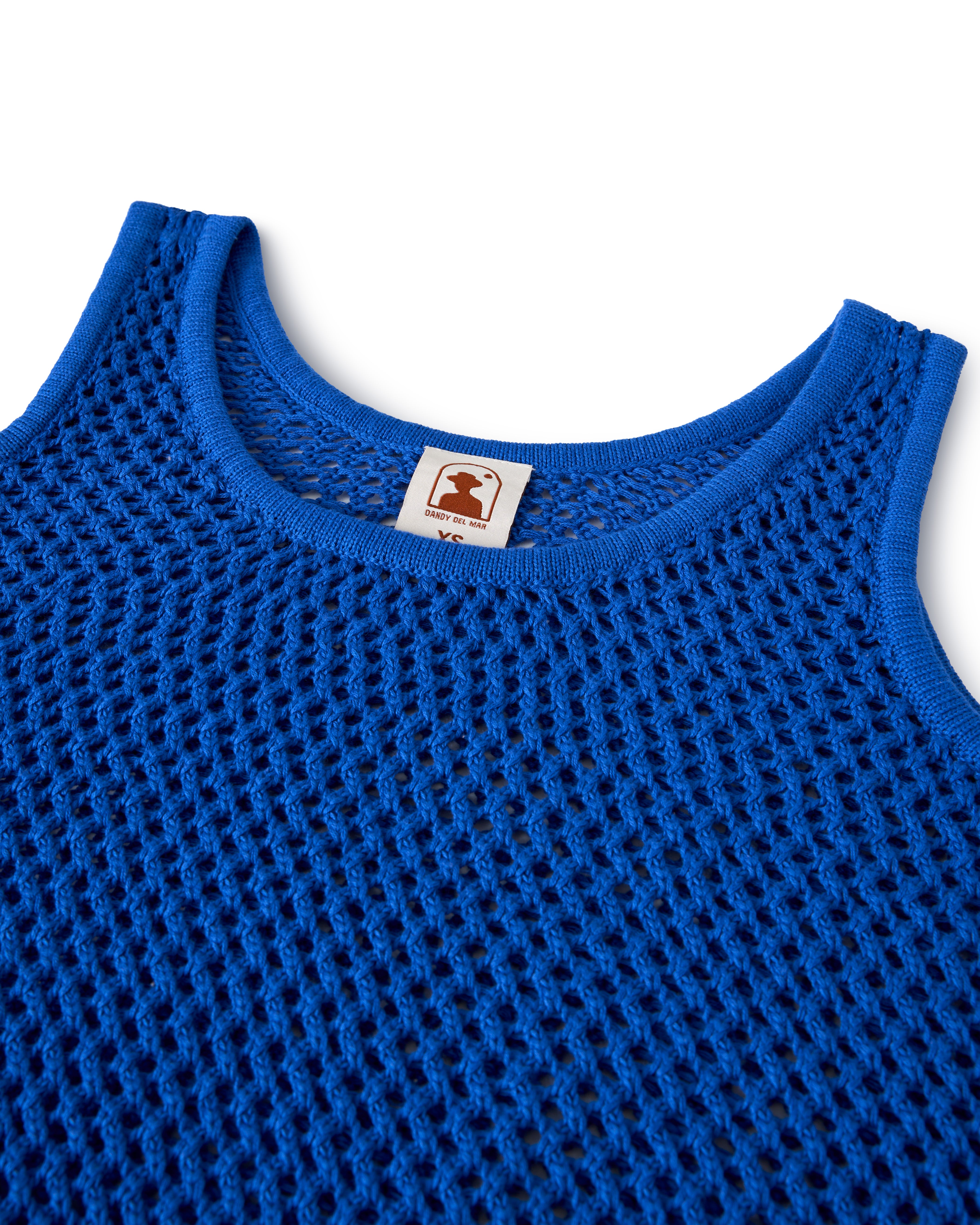 Blue mesh tank top with a rounded neck and branded inside label. Product: The Malaga Crochet Tank - Solana by Dandy Del Mar.