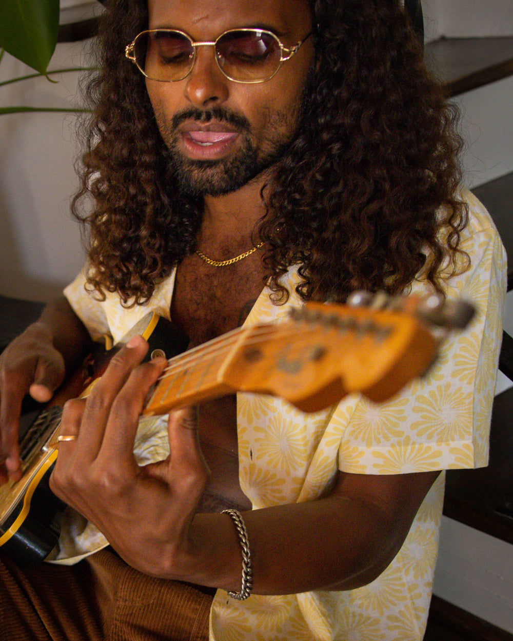 man playing guitar in Dandy Del Mar Grenadine Fleur Shirt