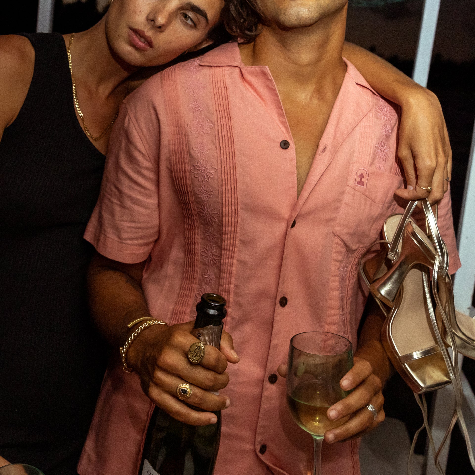 man and woman on boat enjoying happy hour in dandy del mar's brisa set and marbella dress