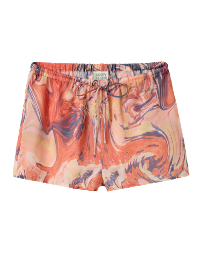 The Curacao Shorts - Lantana by Dandy Del Mar feature an orange and pink marble pattern, relaxed fit, drawstring and elastic waistband, and are finished with the signature Dandy Del Mar label on the band.