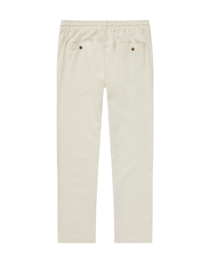 The Brisa Linen Pant - Vintage Ivory by Dandy Del Mar features an elastic waistband and two front pockets for relaxed, effortless style. Straight-leg fit shown flat on a plain background.