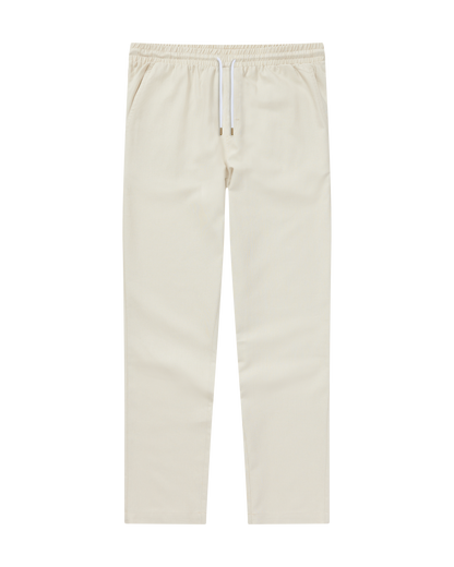 The Brisa Linen Pant - Vintage Ivory by Dandy Del Mar offers a comfy elastic waistband and straight legs—ideal for vacations, shown here against a white background.