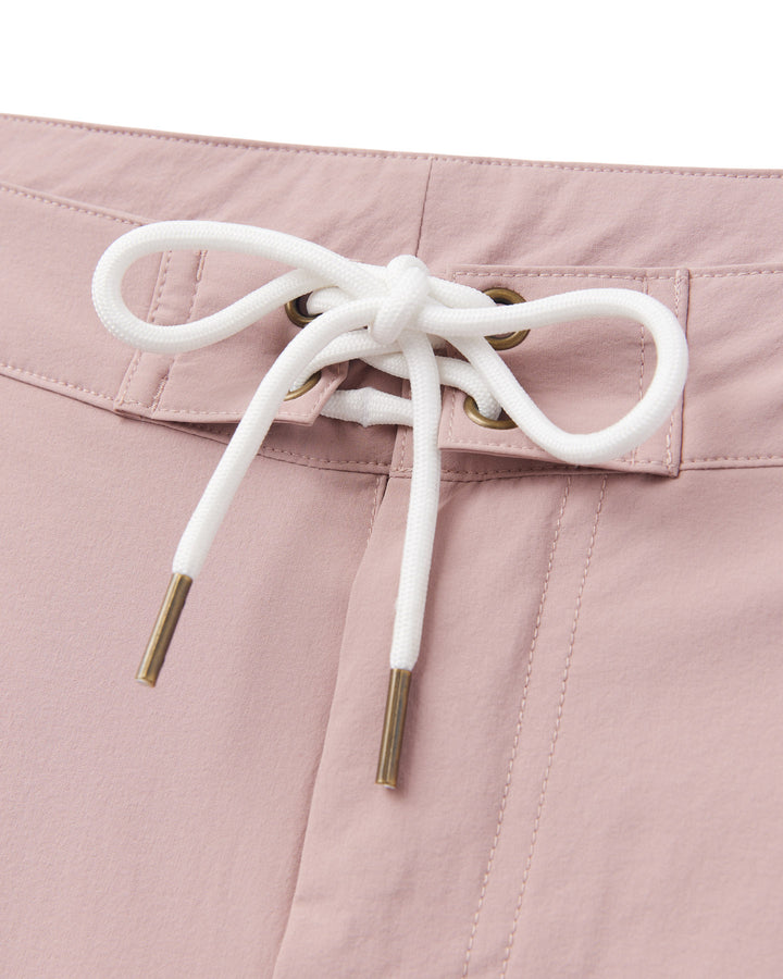 A women's Rosado Swim Short with a white tie, made from performance fabric for optimal comfort by Dandy Del Mar.