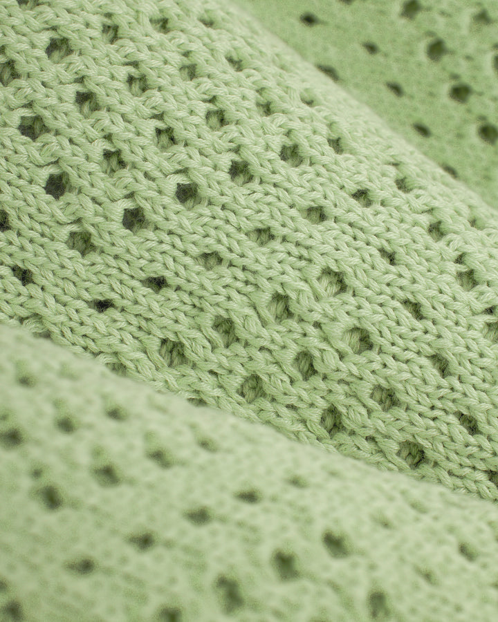A close up of the Dandy Del Mar Antibes Crochet Shirt - Pistachio.