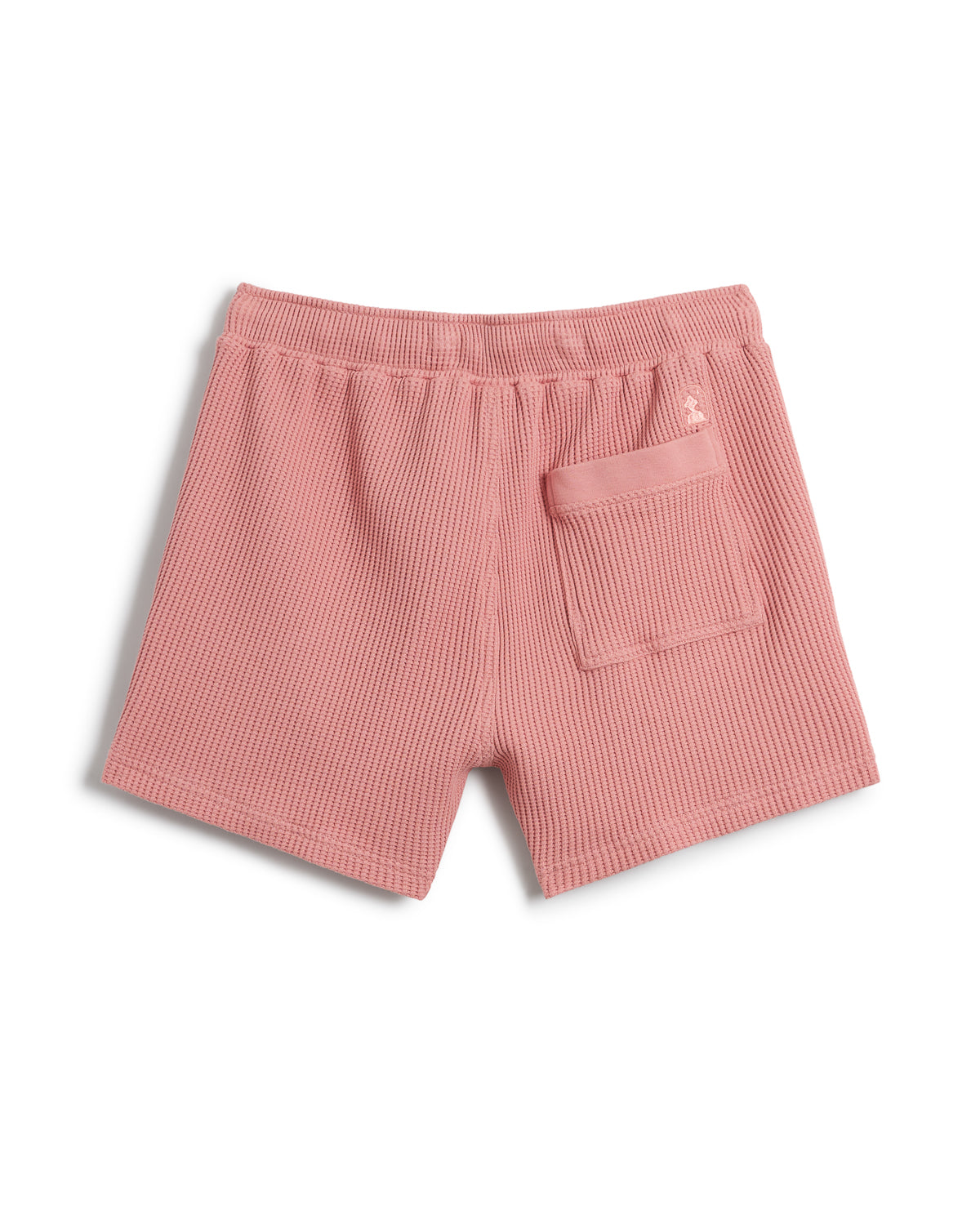 The Cannes Waffle Knit Shorts - Spanish Rose by Dandy Del Mar showcase a pink-colored design made from 100% cotton waffle knit fabric, featuring an elastic waistband and a single back pocket.