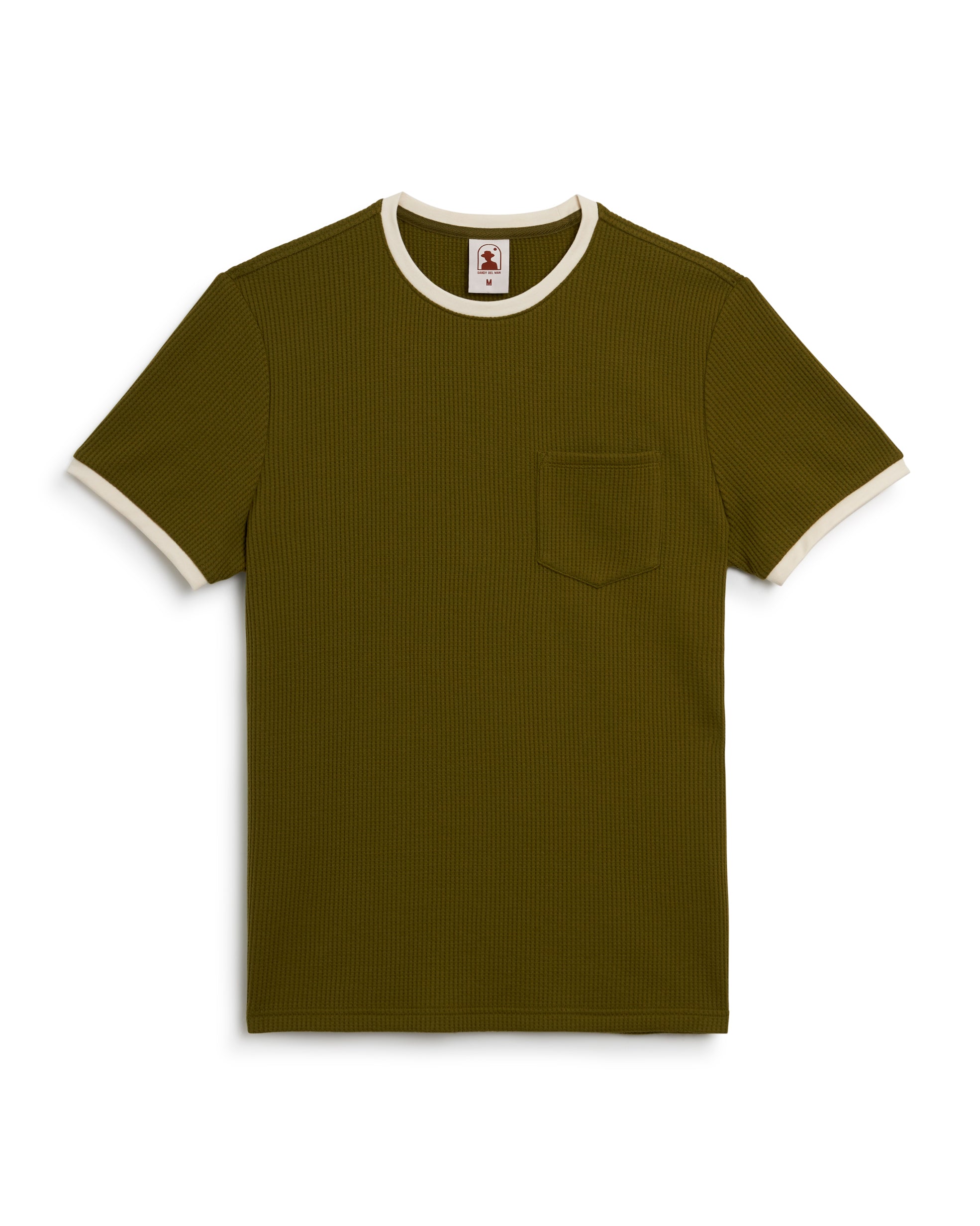 The Cannes Waffle Knit Tee - Arbequina from Dandy Del Mar is olive green with a stylish contrast collar, white sleeve trim, and a left chest pocket. Crafted from waffle knit fabric for texture.