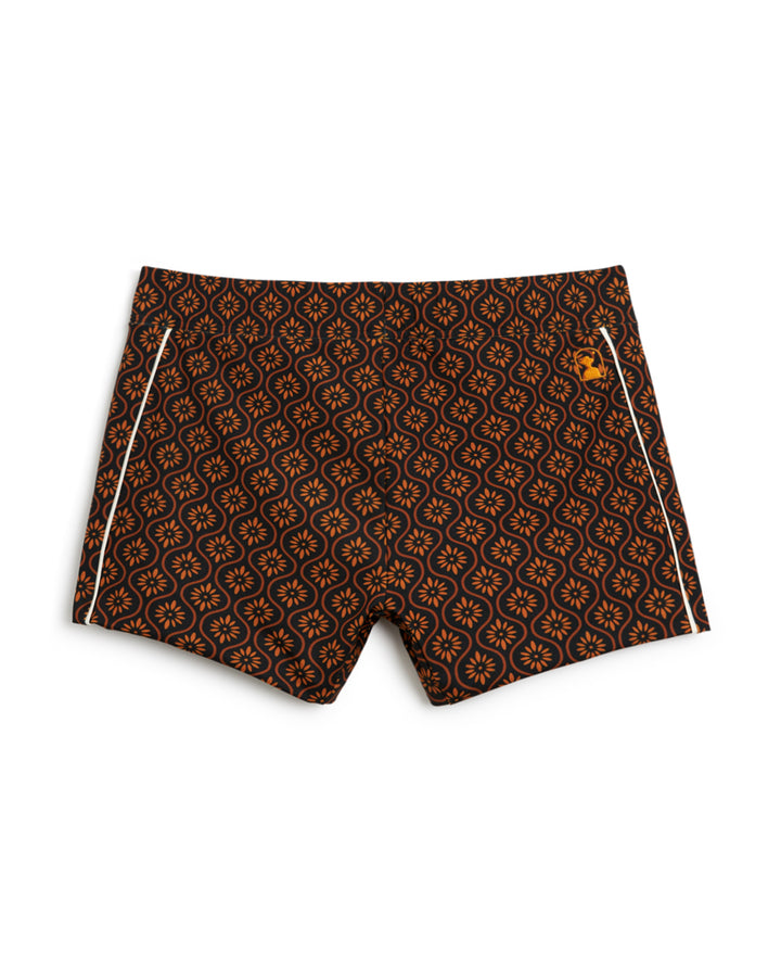 The Dandy Del Mar Cassis Square Cut Swim Brief - Cacao with a geometric pattern.