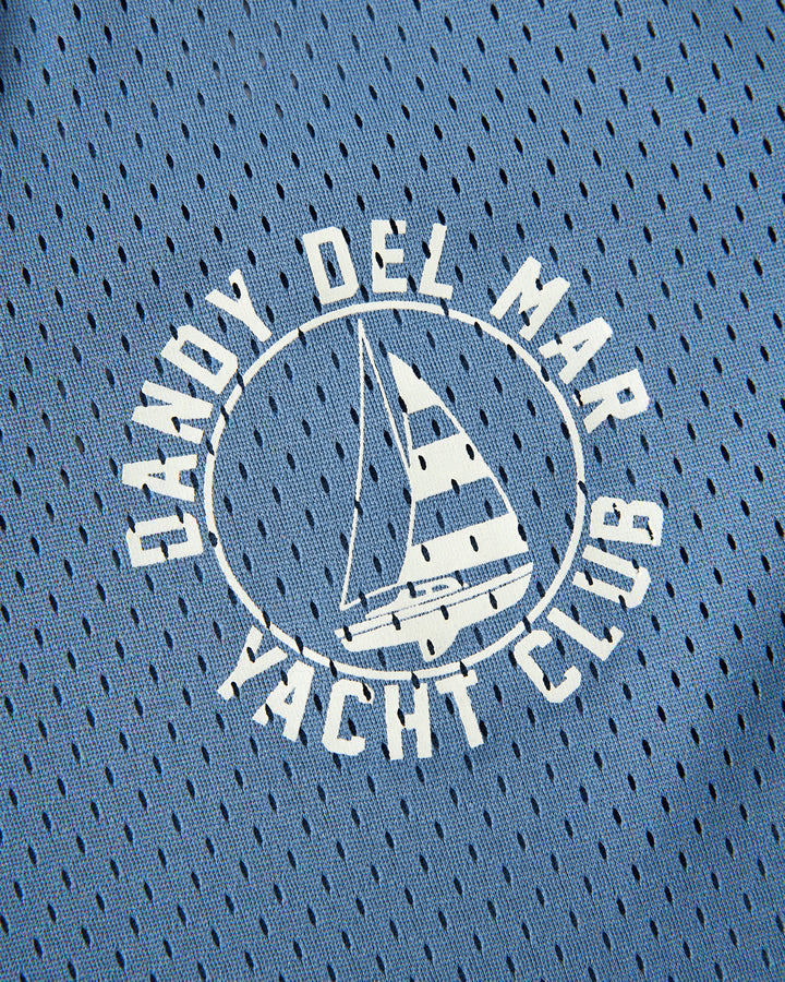 The Dandy Del Mar Kaena Mesh Tee - Annapolis logo on a blue shirt.