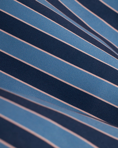 A close up of a blue and pink striped shirt with Mallorca Swim-Walk Short design by Dandy Del Mar.