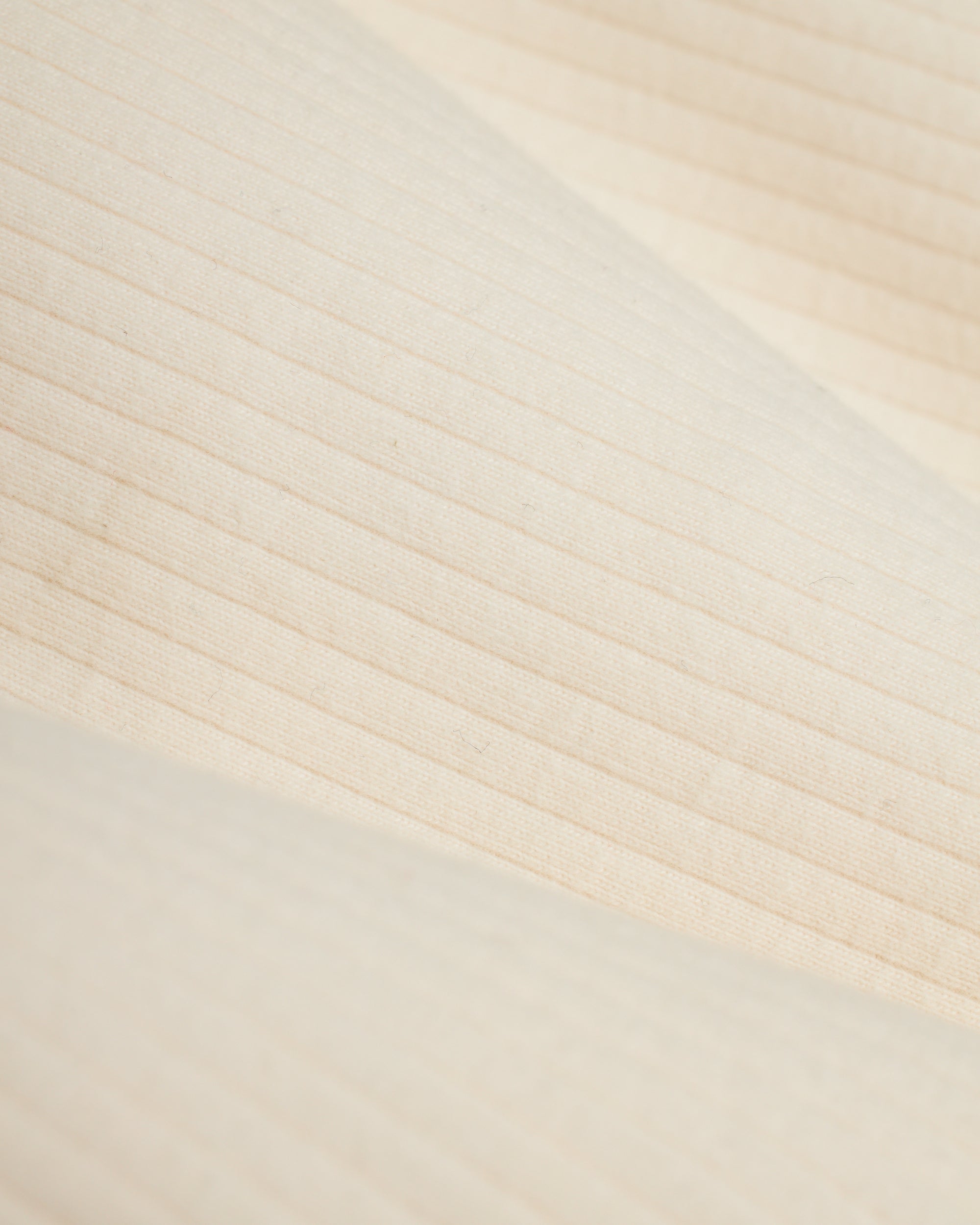 A close up image of the Dandy Del Mar Milan Rib Tank - Shell fabric.