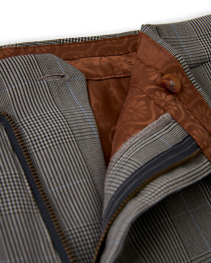 A close up of a brown and grey checkered Dandy Del Mar Tresco trouser suit.