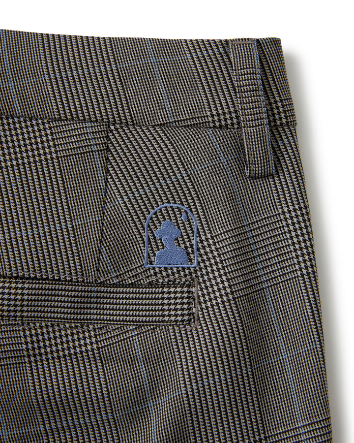 The relaxed fit pocket of a Dandy Del Mar Tresco Trouser - Albatross plaid slacks with a blue logo on it.