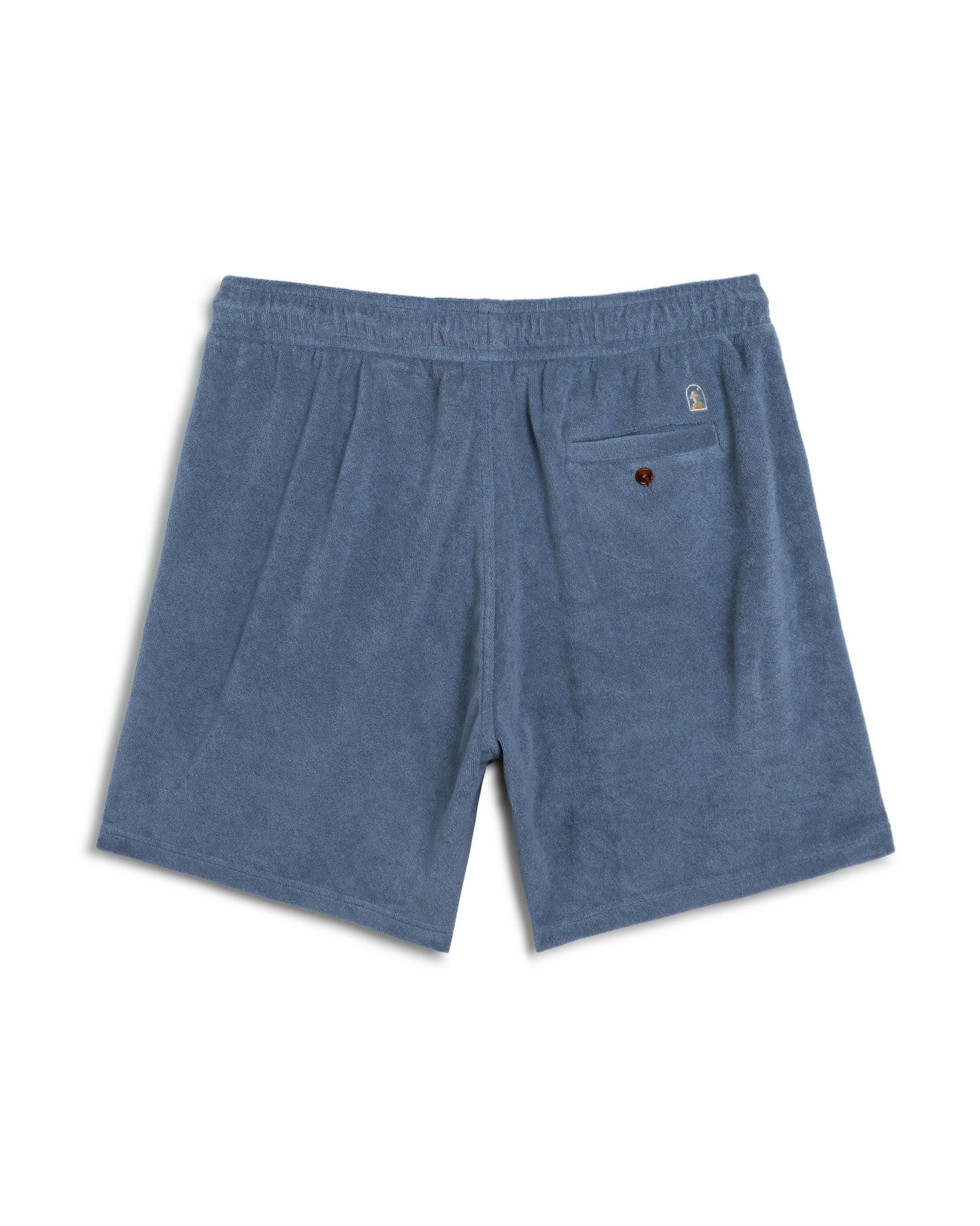 Dandy Del Mar's The Tropez Short - Annapolis features premium terry cloth, an elastic waistband, a rear button pocket, and a small logo tag above it, all in crisp white.