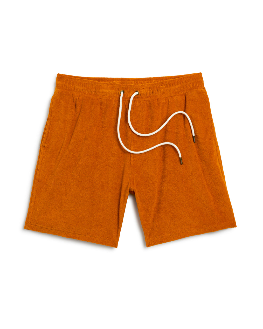 The Tropez Short in Burnt Sienna by Dandy Del Mar is made from terry cloth and features an elastic waistband with white drawstrings. These stylish shorts, complete with two side pockets, are ideal for a laid-back day on the Côte d'Azur.