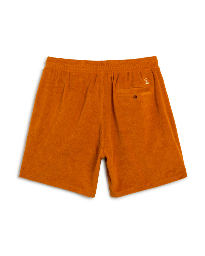 A pair of orange Dandy Del Mar Tropez shorts on a white background.