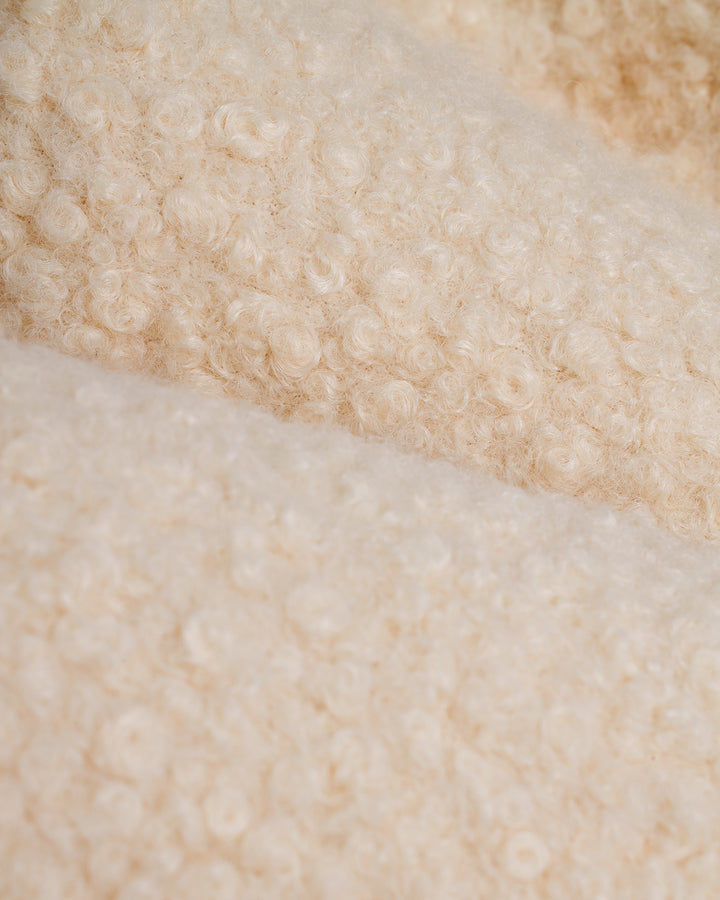 A close up of a Dandy Del Mar Cusco Sherpa Pullover - Vintage Ivory.