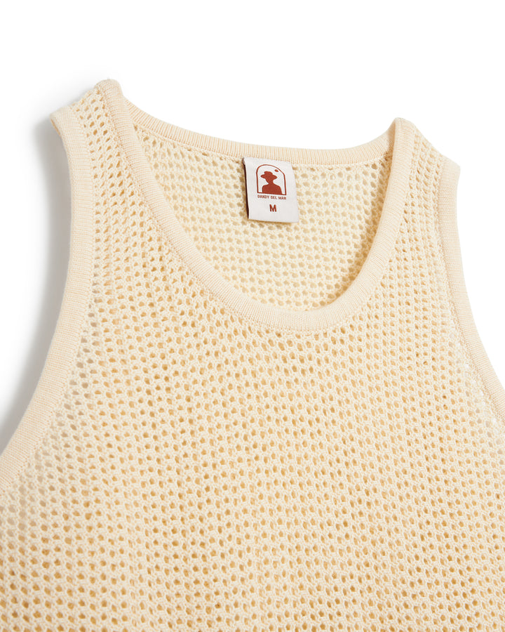 Close-up of a beige lightweight Dominica Crochet Tank - Vintage Ivory by Dandy Del Mar with a size 'm' label.