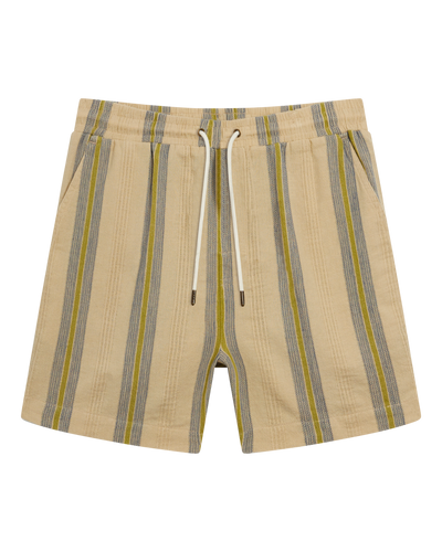 The Corralejo Shorts - Ginger by Dandy Del Mar: beige crinkle gauze shorts with vertical blue and yellow stripes, elastic waist, white drawstring, and side pockets—summer essentials shown on a white background.