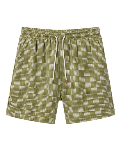 The Grenadine Crinkle Gauze Shorts - Berdea Palermo Print by Dandy Del Mar feature a green and white checkered pattern, relaxed fit, soft crinkle gauze fabric, elastic waistband, and white drawstring, shown on a plain background.