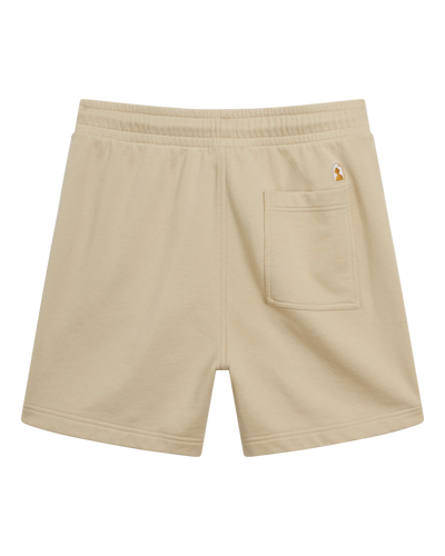 The Marseille French Terry Shorts in Ginger by Dandy Del Mar, shown from the back, feature an elastic waistband and a single right back pocket with a small logo patch above it.