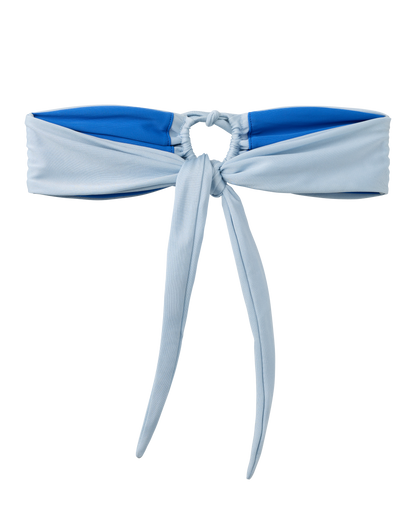 The Biarritz Top - Comet by Dandy Del Mar is a blue and light blue tie-front bandeau bikini top with a circular center ring, cinch detail, and adjustable front ties for a customizable fit.
