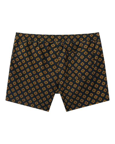 The Ventura Volley Shorts in Oro Gardenia Print by Dandy Del Mar feature a yellow floral geometric design and elastic waist—perfect for stylish men's swimwear, displayed against a white background.