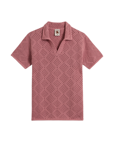 The Antibes Crochet Polo Shirt - Dawn by Dandy Del Mar: a mauve, short-sleeve, open-collar polo with a diamond crochet pattern and perforated texture, shown laid flat on a white background.