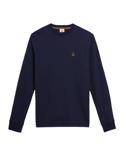The Dandy Del Mar Cannes LS Waffle Knit Shirt in Luxe Navy features long sleeves, soft waffle knit fabric, and a small embroidered chest logo, displayed flat on a white background.