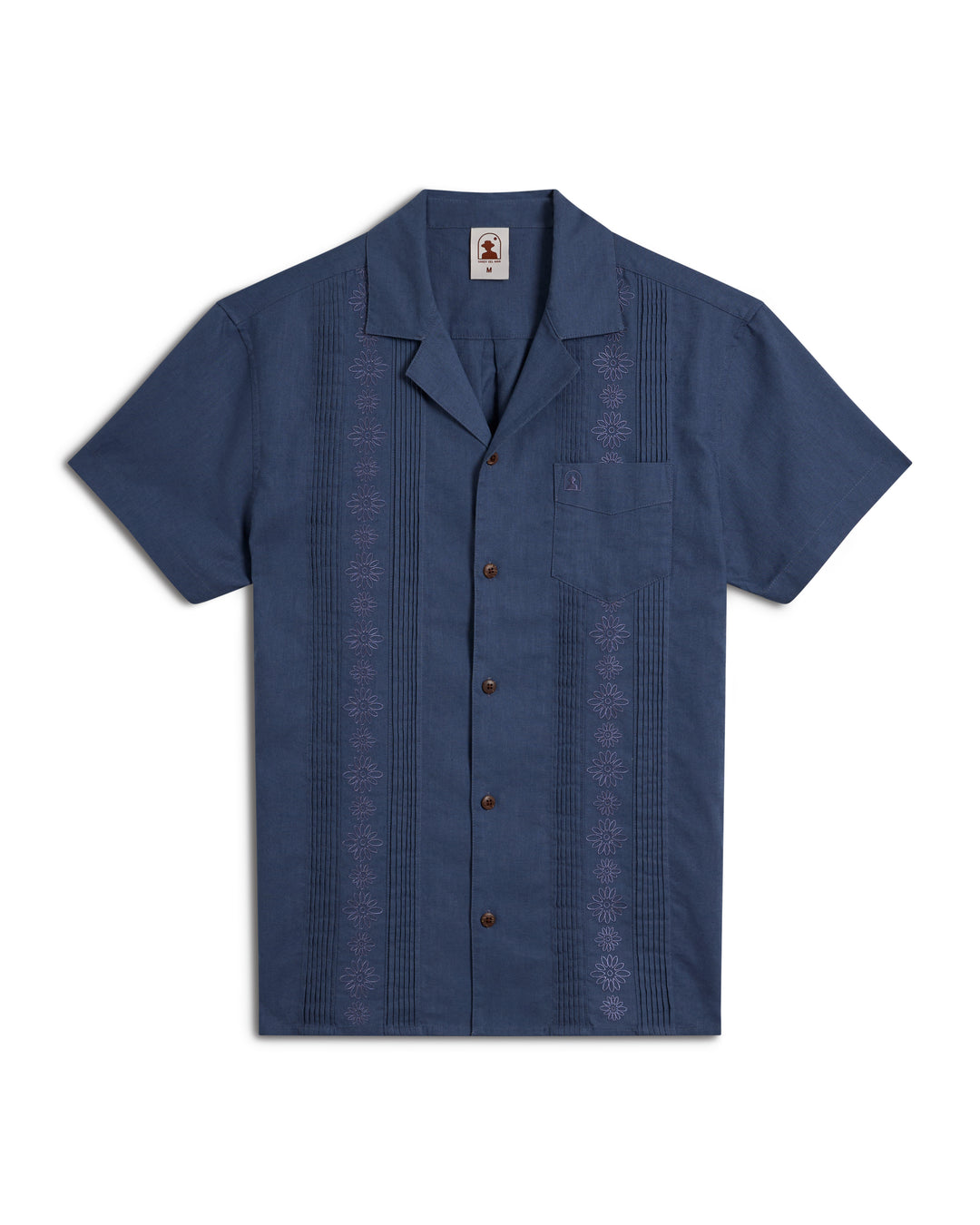 A short-sleeve blue Brisa Linen Shirt by Dandy Del Mar, featuring intricate embroidery and a chest pocket, displayed against a white background.