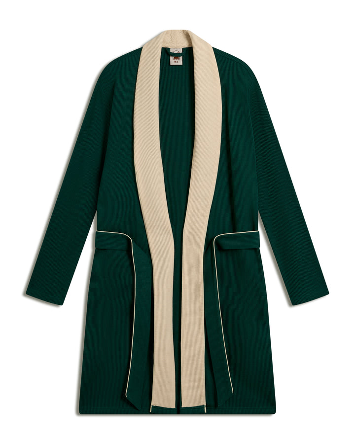 The Cannes Waffle Knit Robe - Albero by Dandy Del Mar is a long green cardigan with a cream lapel and belt, showcasing ribbed fabric and pocket detailing.