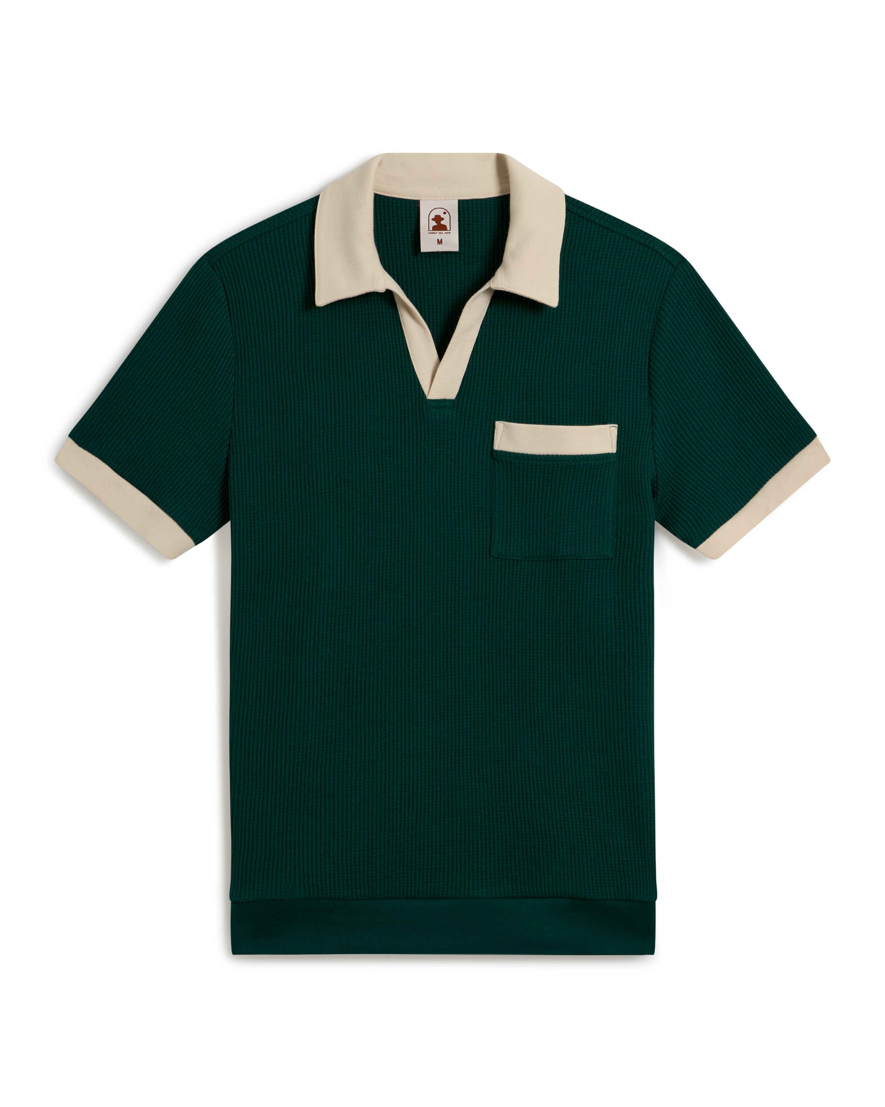 The Cannes Waffle Knit Shirt - Albero by Dandy Del Mar is a green short-sleeve polo with a beige collar and pocket trim, featuring a ribbed texture.