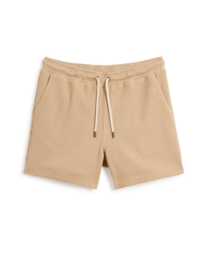 The Cannes Waffle Knit Shorts - Truffle by Dandy Del Mar: Truffle-colored drawstring shorts with two side pockets, featuring a ribbed texture and crafted from 100% cotton waffle knit fabric.