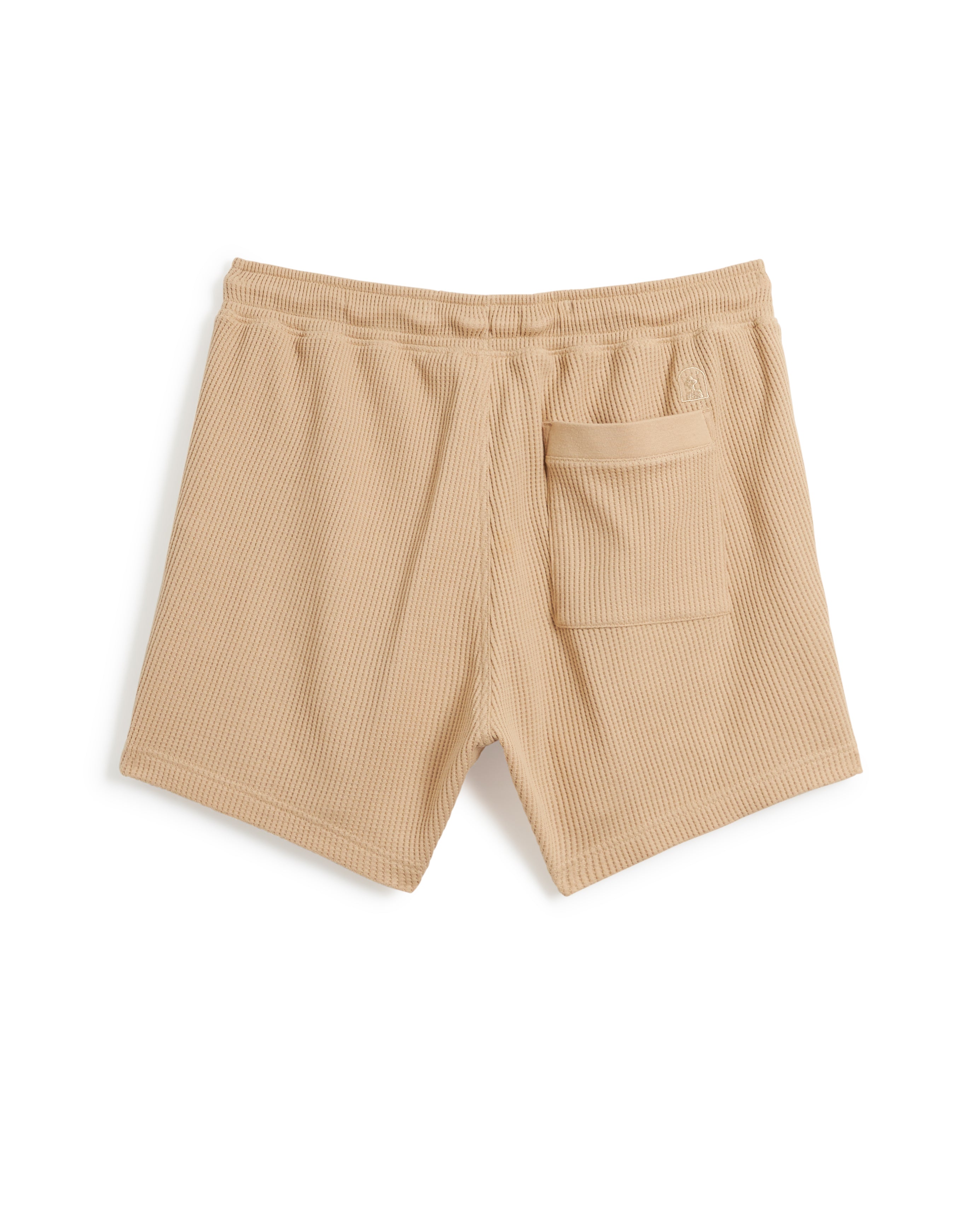 A pair of The Cannes Waffle Knit Shorts - Truffle by Dandy Del Mar, made from 100% cotton with an elastic waistband and a single back pocket, displayed on a white background. Crafted with attention to detail for added comfort.