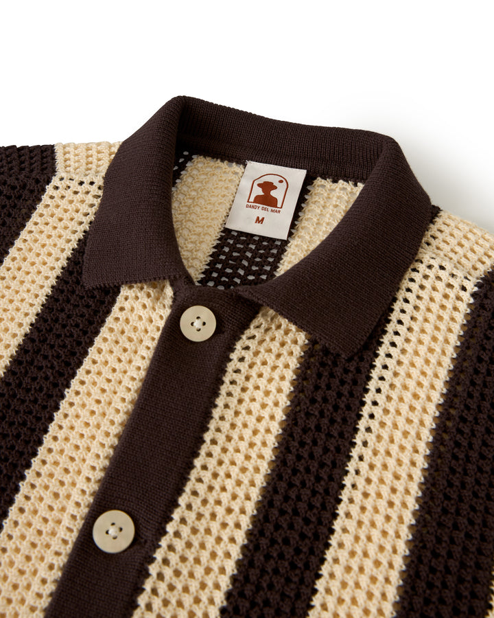 The Dominica Crochet Shirt - Tierra by Dandy Del Mar is a collared shirt with brown and beige vertical stripes, a knitted mesh design, large buttons, and an inside collar label.