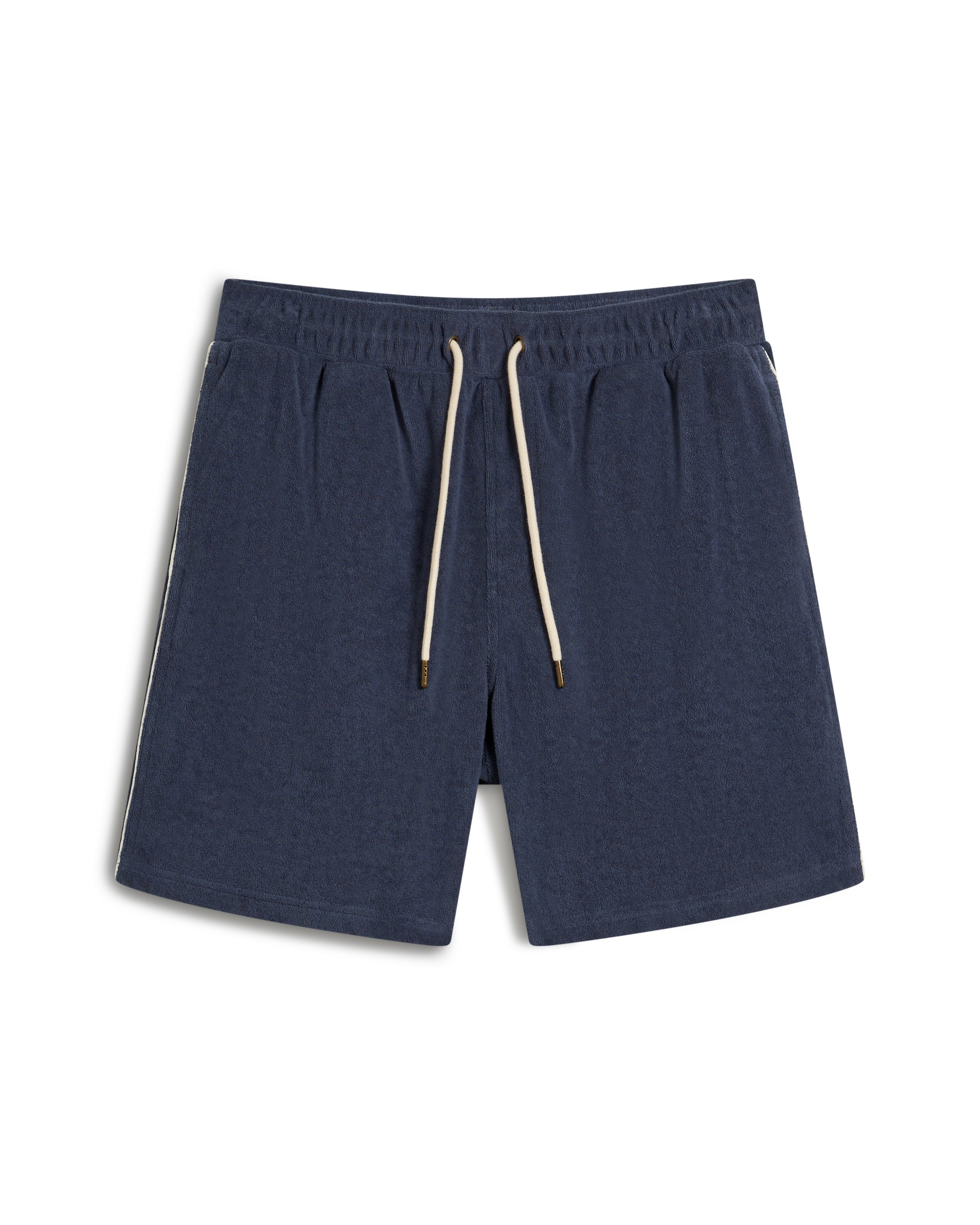 The Gaucho Short - Moontide by Dandy Del Mar are cozy terry cloth athletic shorts in dark blue, featuring an elastic waistband and white drawstrings, displayed on a white background.