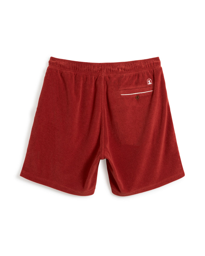 Back view of The Gaucho Terry Cloth Short - Rouge from Dandy Del Mar, showcasing an elastic waistband, crafted from ultra-soft terry cloth and featuring a single buttoned rear pocket.