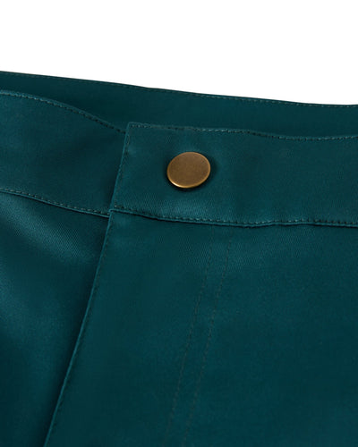 Close-up of The Mallorca Swim-Walk Shorts in Tempest Blue by Dandy Del Mar, featuring a fabric waistband with a brass button, visible stitching, and adjustable brass fasteners.