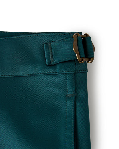 Close-up of The Mallorca Swim-Walk Shorts in Tempest Blue by Dandy Del Mar, showing a single-layer nylon waistband with adjustable brass fasteners and a stitched belt loop against a white background.