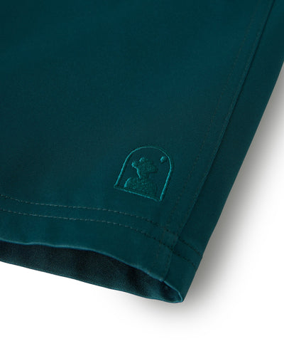 Close-up of the hem on The Mallorca Swim-Walk Shorts in Tempest Blue by Dandy Del Mar, crafted from single-layer nylon with a small embroidered logo near the edge.