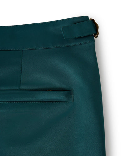 Close-up of The Mallorca Swim-Walk Shorts in Tempest Blue by Dandy Del Mar, featuring an adjustable waistband with brass fasteners, a belt loop, and a back welt pocket.