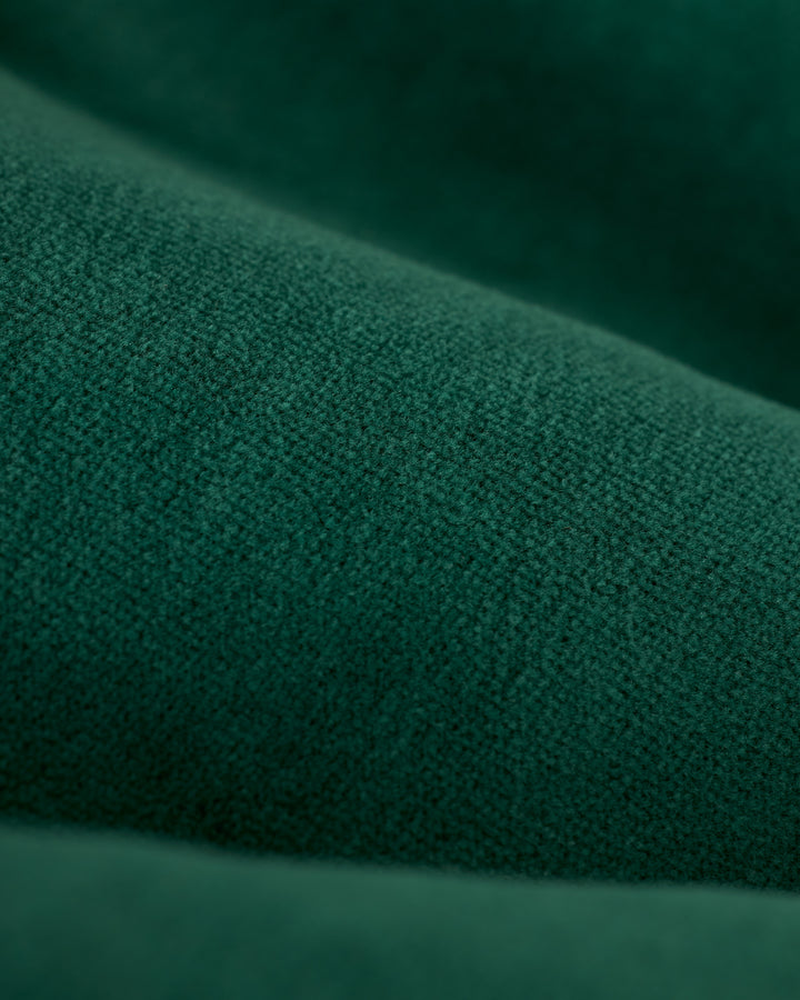 Close-up of the Albero fabric from The Rio Velour Short by Dandy Del Mar, highlighting its soft, textured surface in green.