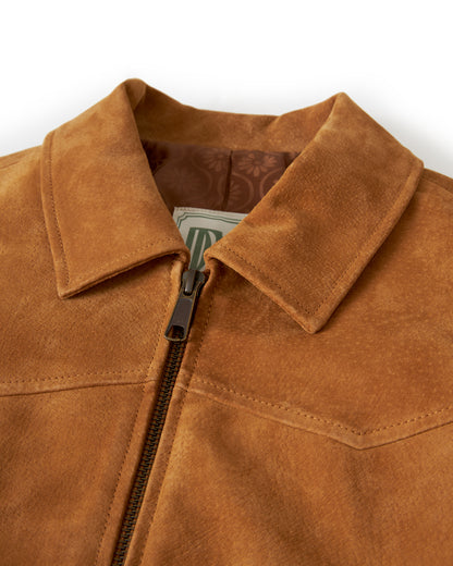 Close-up of the collar on The Sicily Leather Jacket - Sable by Dandy Del Mar, featuring an exposed zipper that is partially open to reveal a jacquard lining and a folded dollar bill tucked inside.